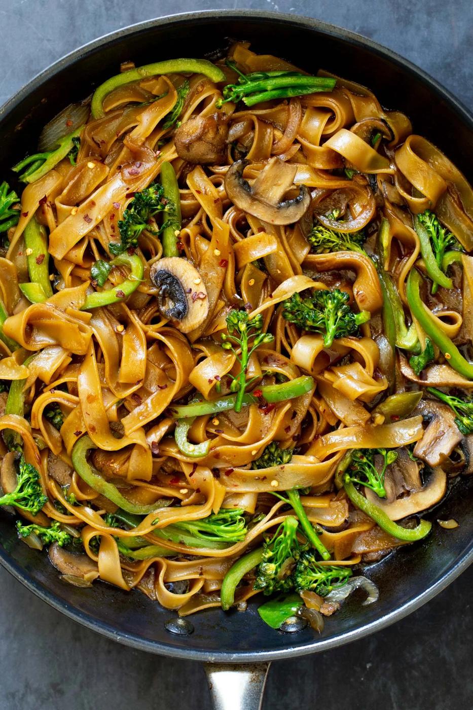 a frying pan with Thai Skillet Noodles tossed with sweet salty sauce and vegetables