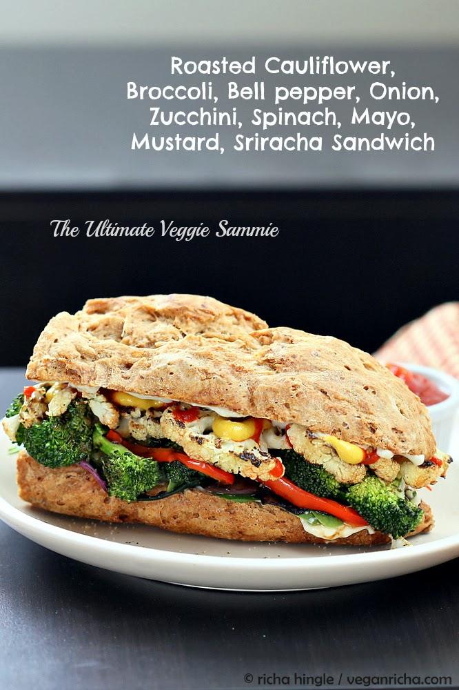 side view of a vegan roasted vegetable sandwich made with grilled broccoli, cauliflower, bell pepper and sriracha mayo