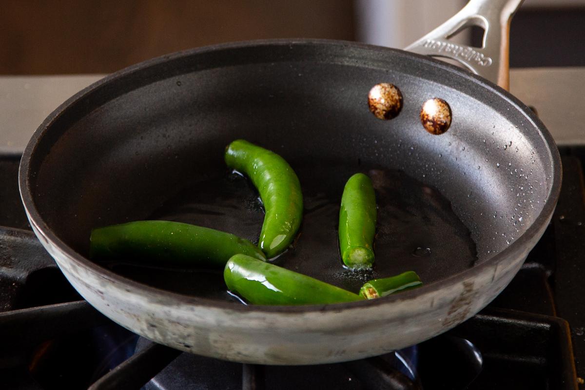 chilis in the pan before cooking