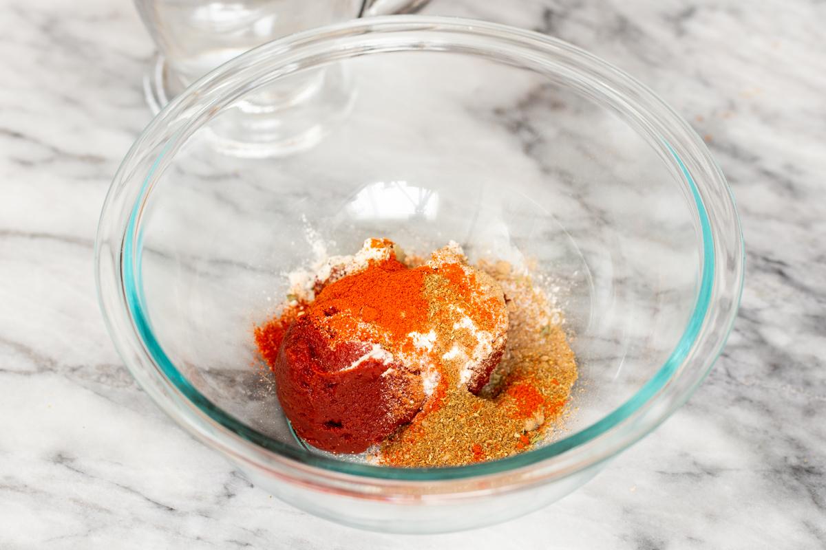 ground spices for masala sauce in a small glass dish