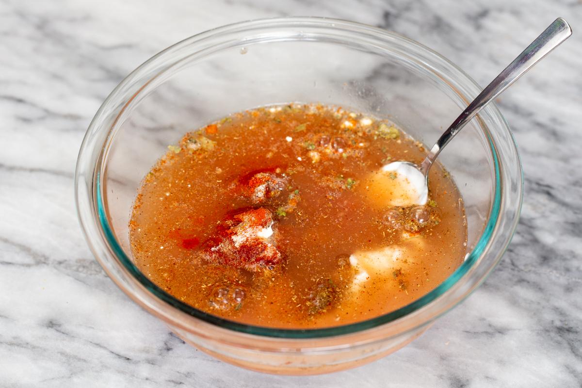 ingredients for masala sauce being combined in a small glass dish