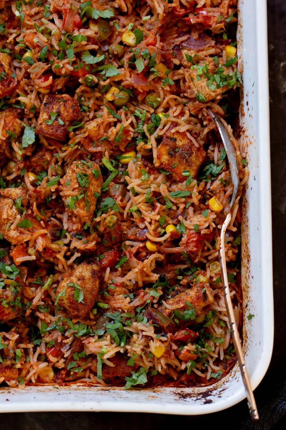 close-up of tikka masala rice in the baking pan after baking and fluffing