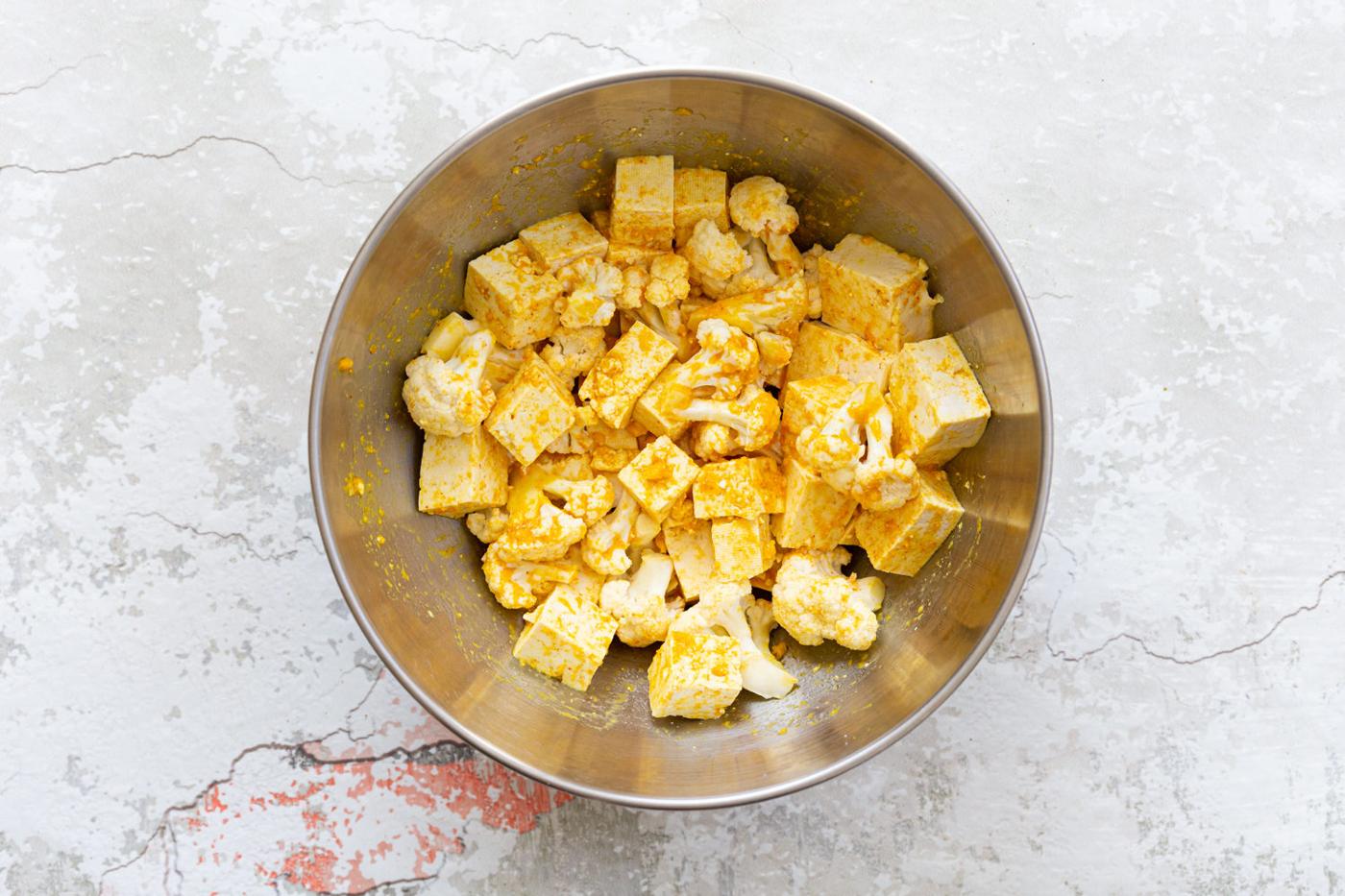 Tofu and Cauliflower in a steel bowl