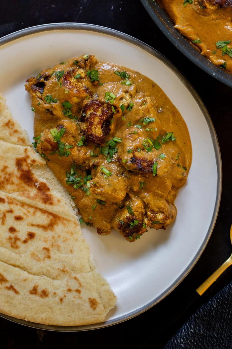 tofu barra on a plate with a side of flatbread