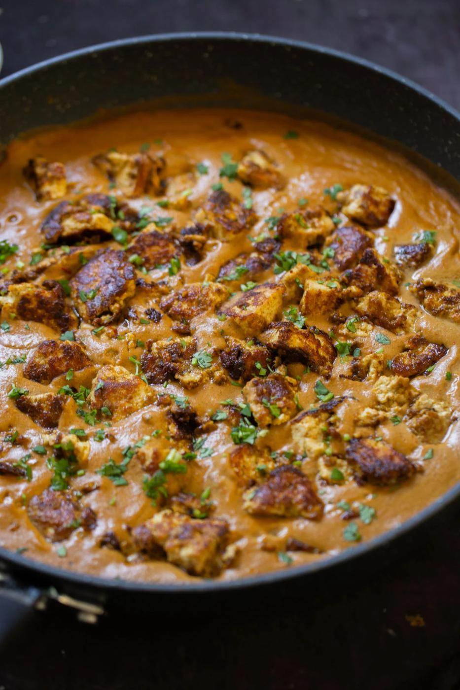 close-up of tofu barra in the pan after cooking and adding garnishes