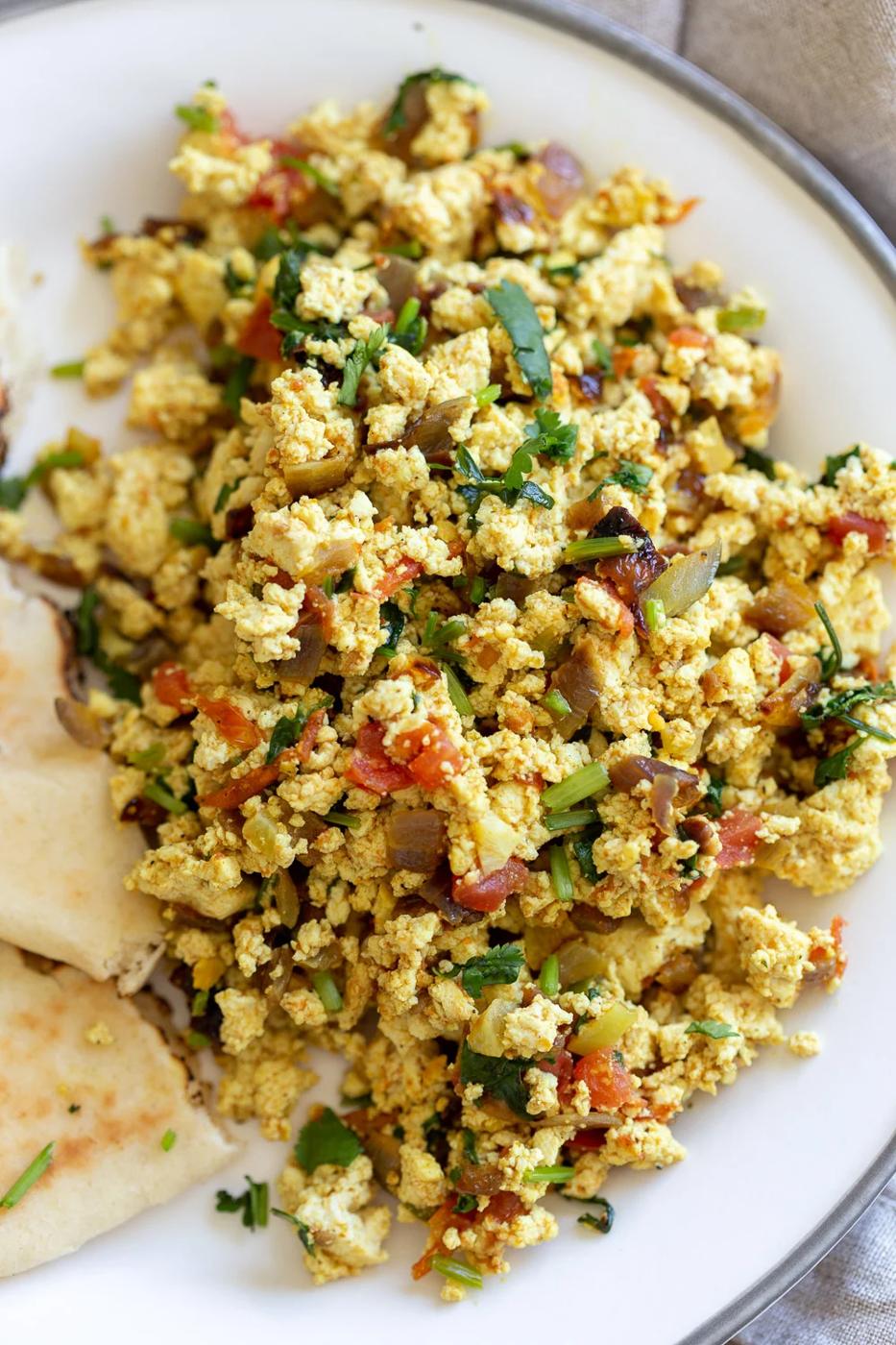 Tofu Bhurji - Vegan Bhurji or Akoori . Indian Scrambled eggs. Tofu scrambled with onion, tomato, cilantro and cumin for a delicious Eggless Bhurji Scramble Breakfast. #Vegan #Glutenfree #Nutfree #Recipe #VeganRicha #indianRecipe #tofuburji Can be soyfree.