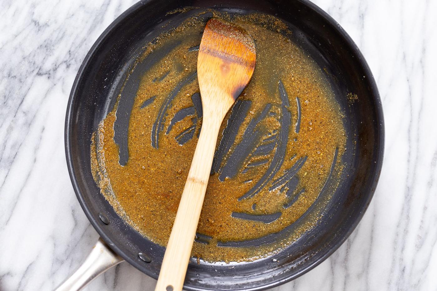 spices being fried in hot oil