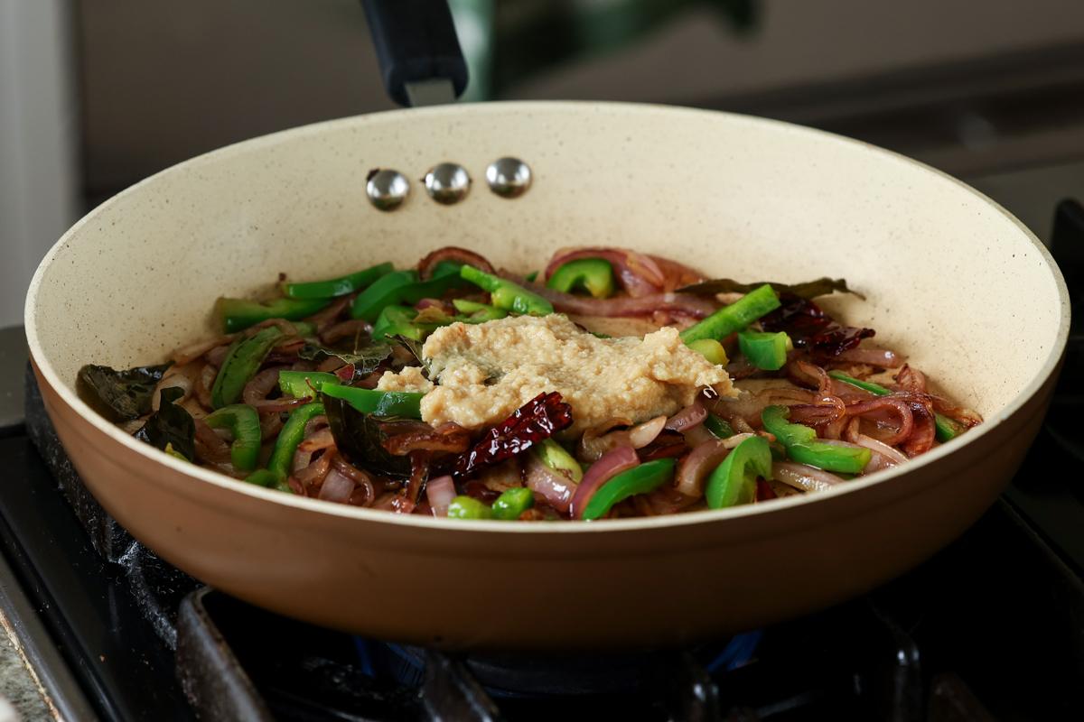 adding ginger garlic paste to the pan