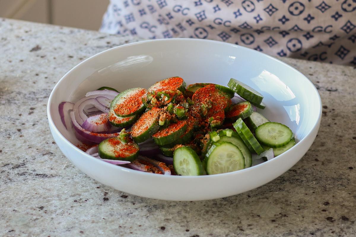adding spices to the bowl