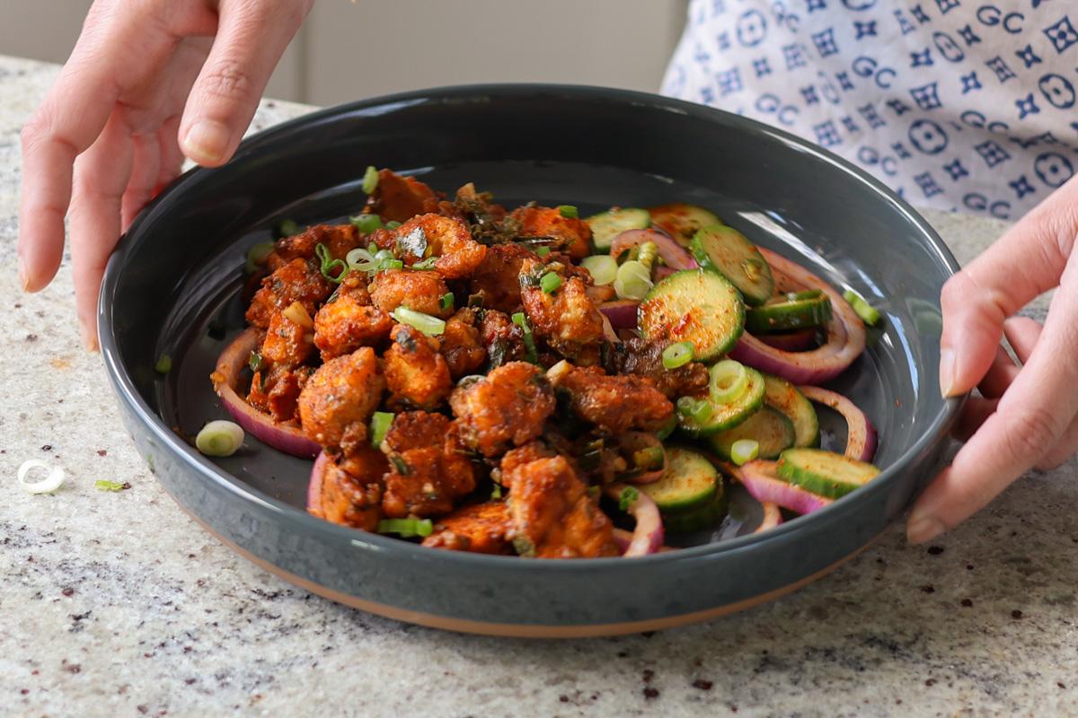tofu majestic in a bowl with laccha onions