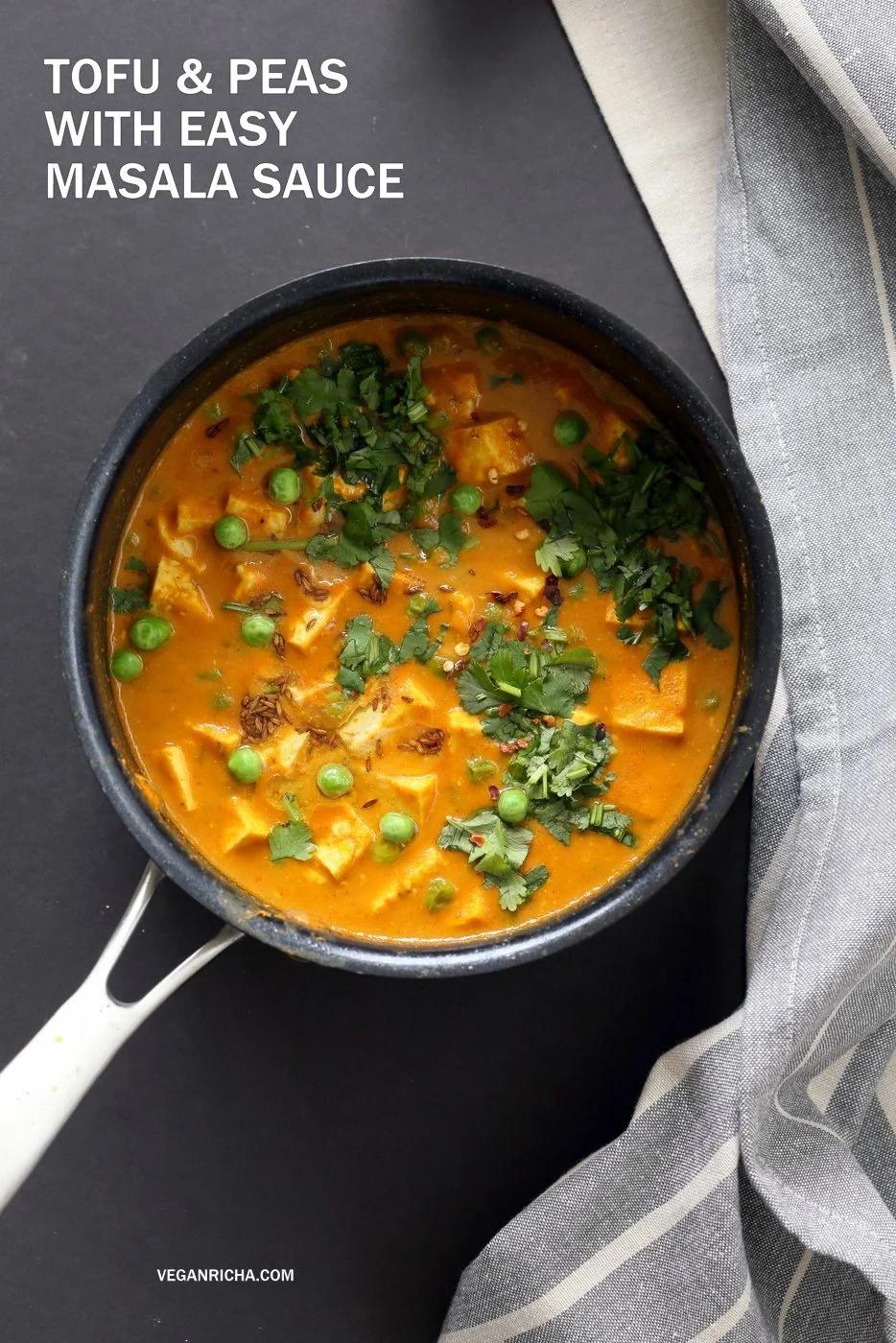 Tofu Peas Curry in a black saucepan garnished with toasted cumin, Indian Tofu Matar Masala