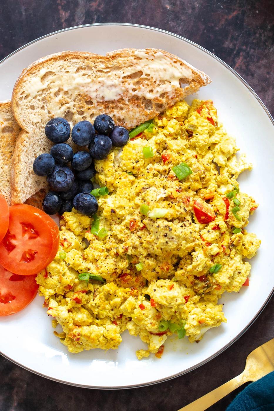 vegan tofu scramble served with blueberries and buttered toast