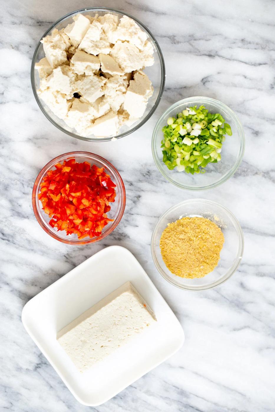 ingredients for vegan tofu scramble on a marble countertop