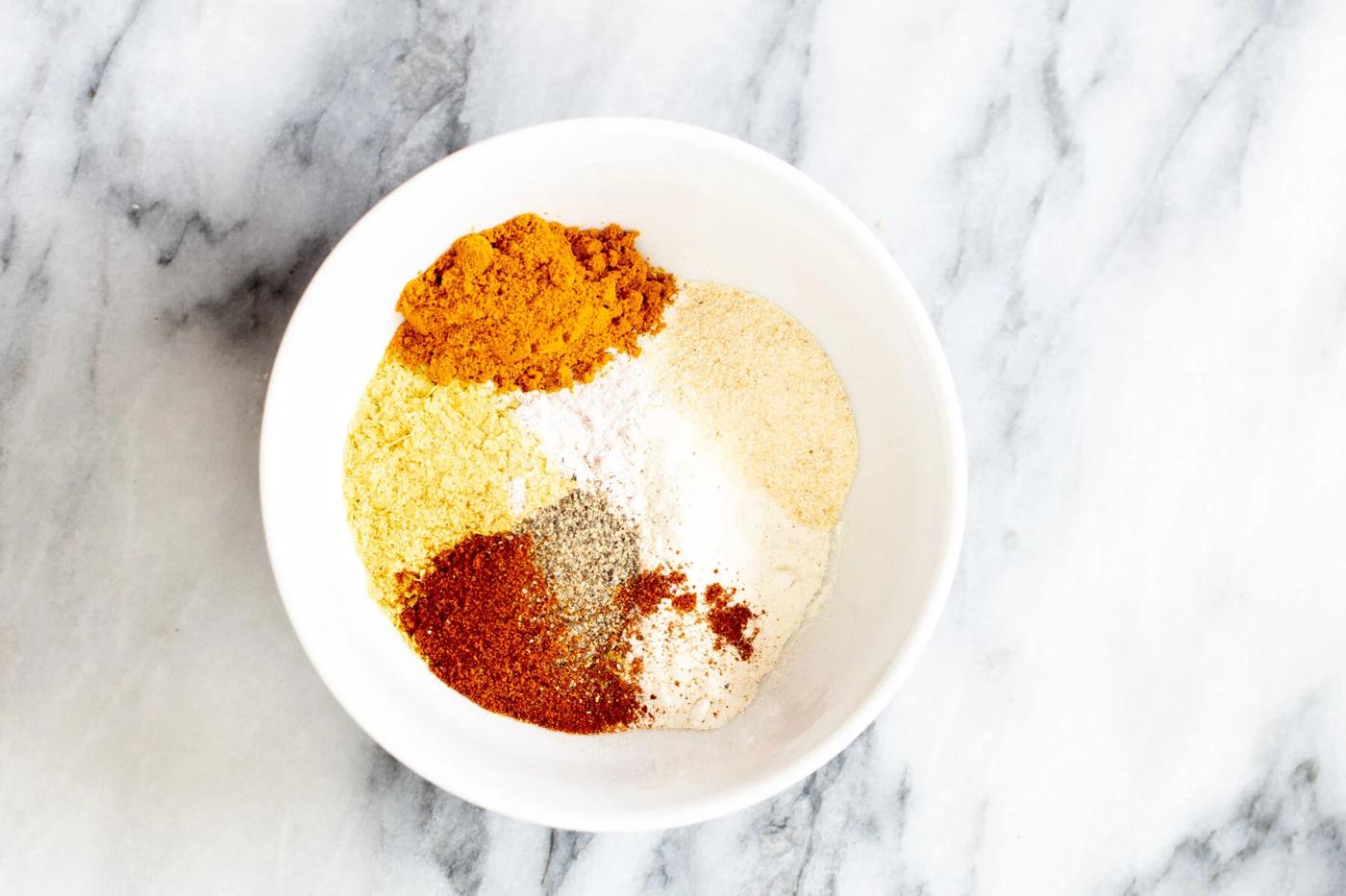 seasoning for tofu scramble in a white bowl