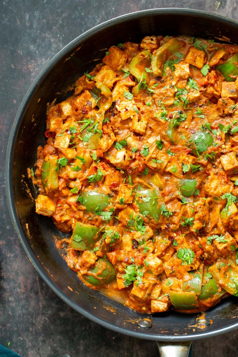 tofu tikka masala in a black sauteeing pan