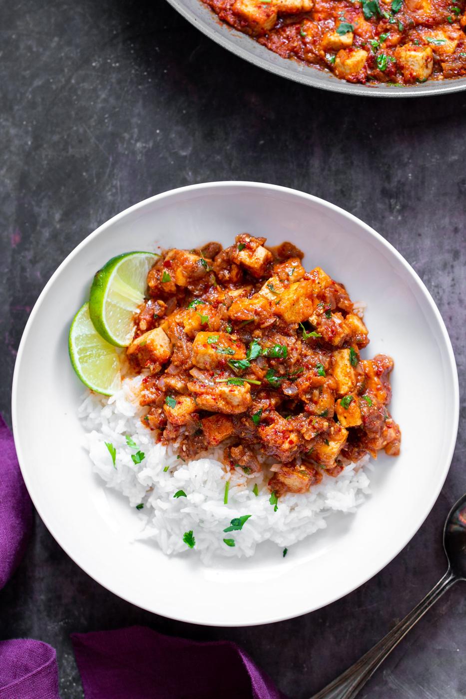 vegan tofu curry vindaloo served with rice and sprinkled with parsley