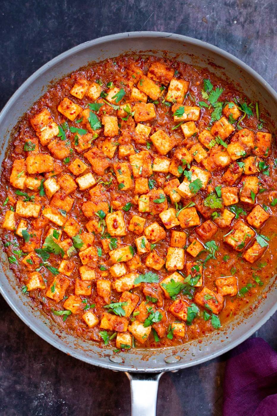tofu vindaloo curry in a grey skillet