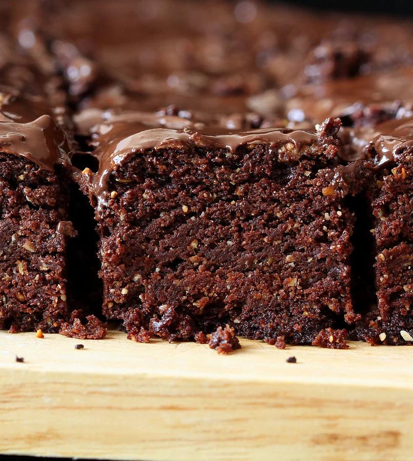 side view close-up of Triple Chocolate Salted Caramel Brownies with chocolate glaze