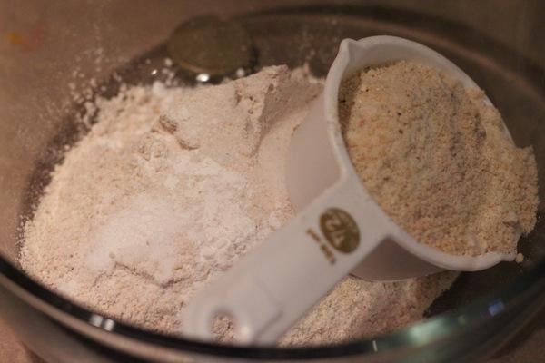 dry ingredients for vegan salted caramel brownies being measured out in a glass bowl