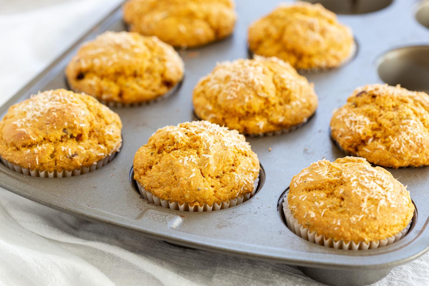 Our Vegan Turmeric Carrot Muffins in a muffin pan