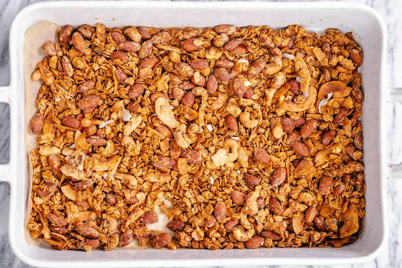 a white casserole dish filled with baked vegan granola