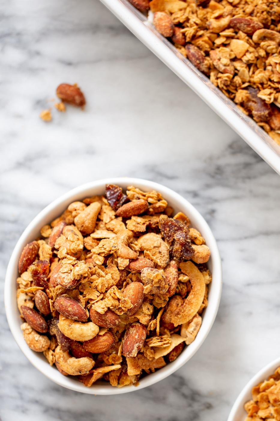 overhead shot of a bowl of baked vegan coconut almond granola