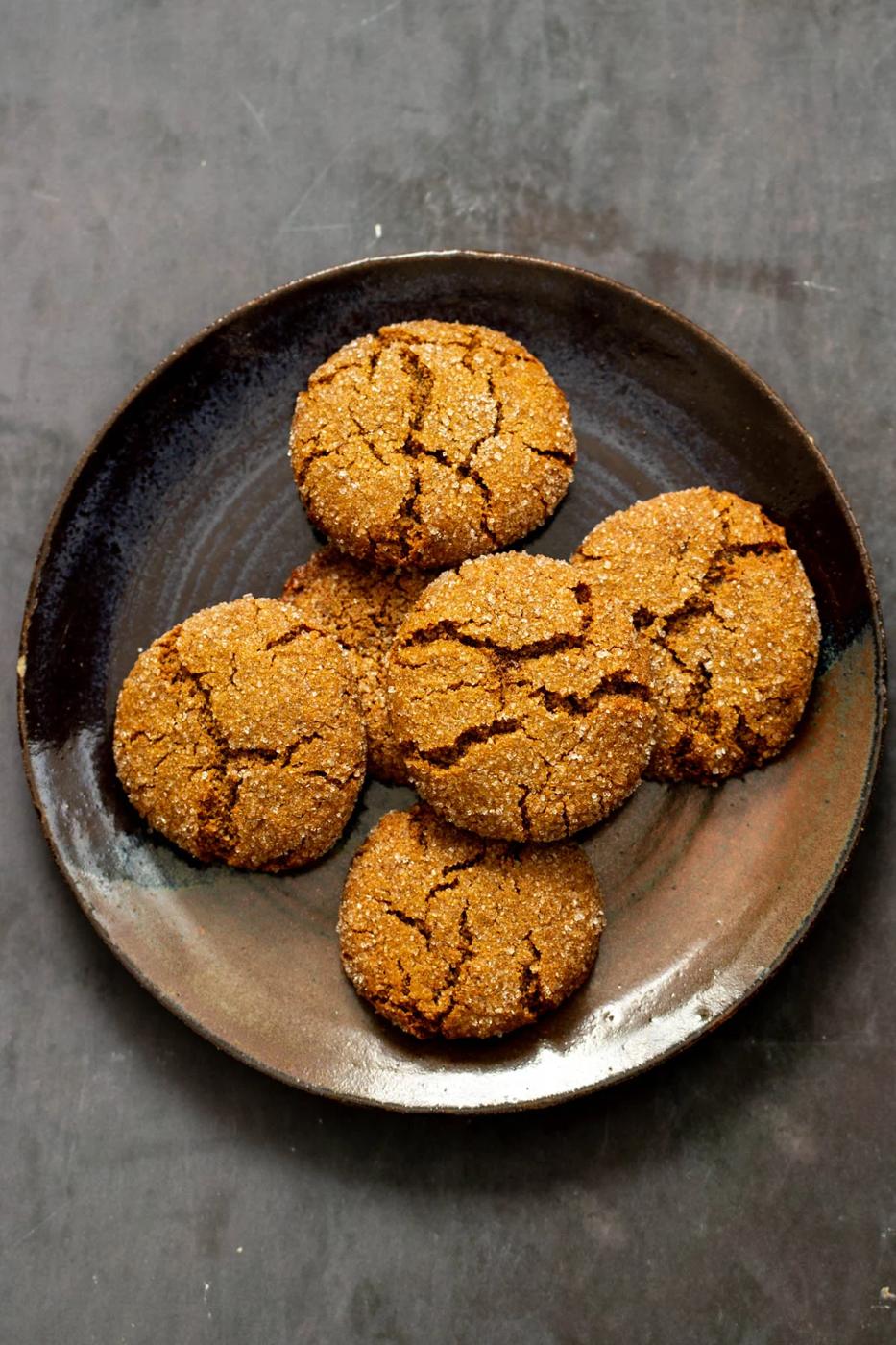 a plate of soft spiced almond flour ginger cookies with crinkly tops