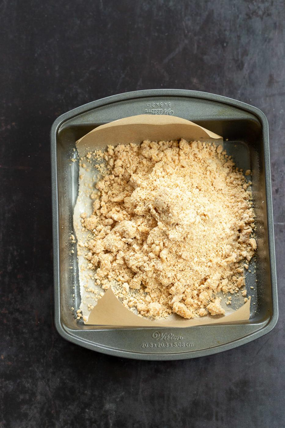 Crust for our Vegan Apple Custard Squares in a lined brownie pan