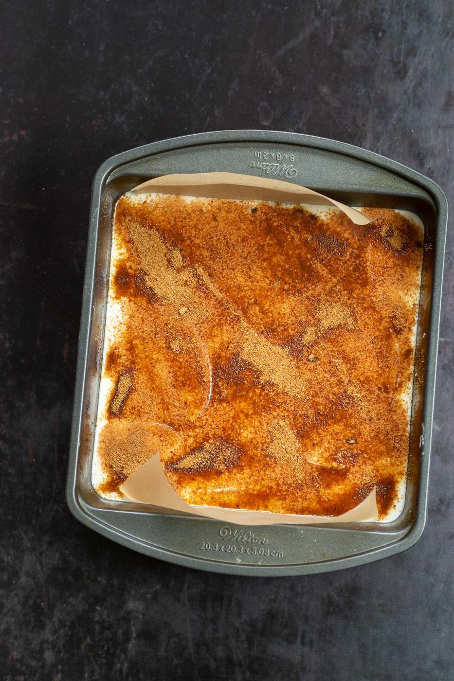 Our Vegan Apple Custard Squares in a lined brownie pan
