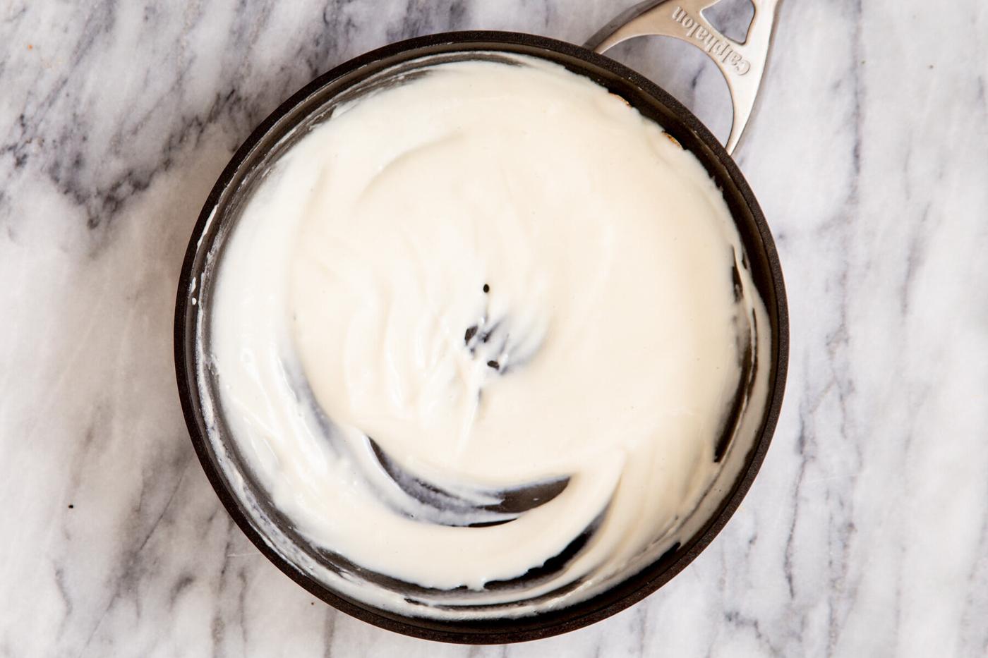 vegan cashew custard cooking in a small saucepan