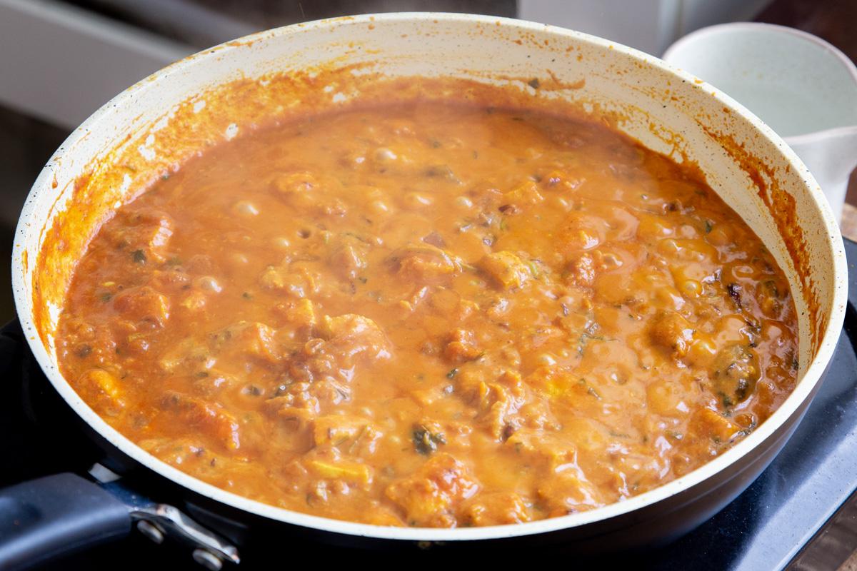 a pan with vegan balti chicken