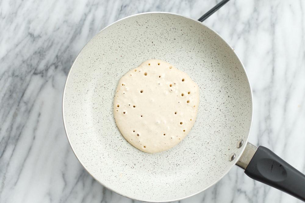 Banana Oat Pancake batter on white stone skillet