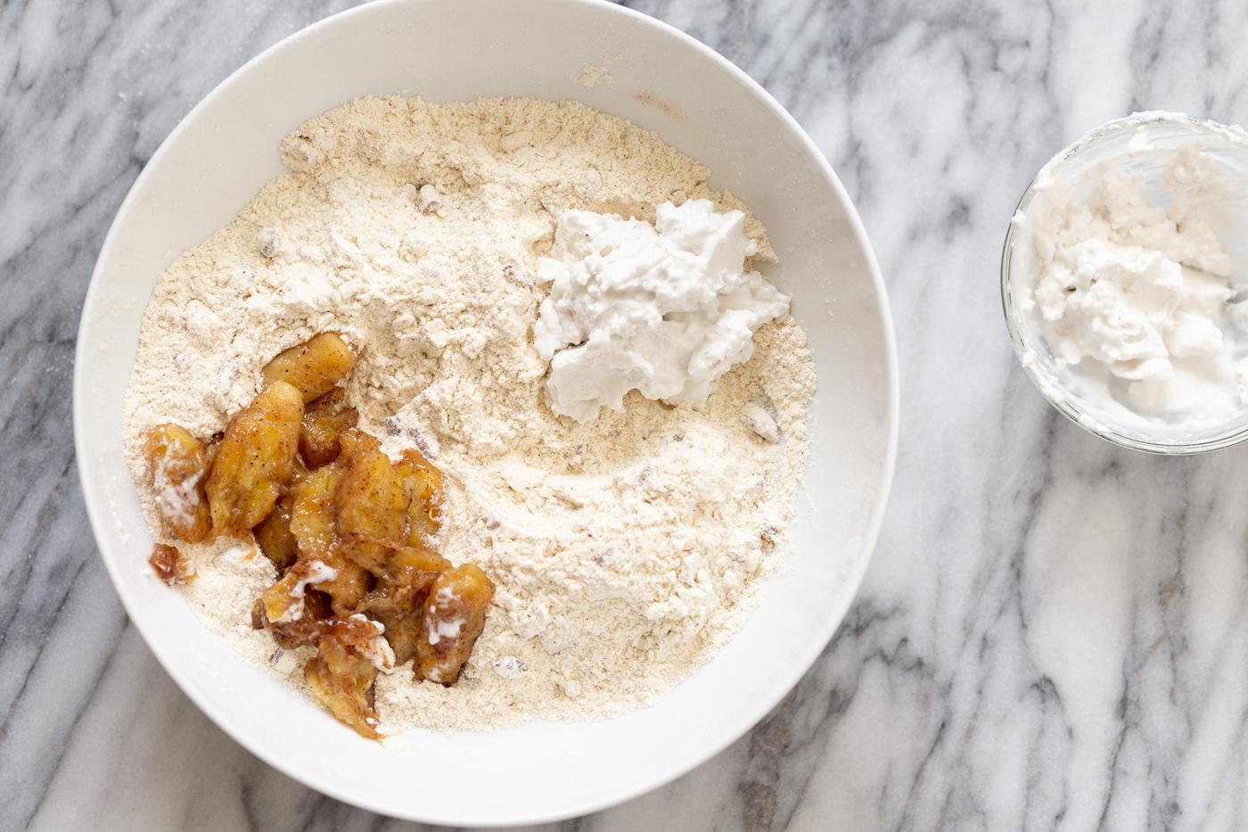 ingredients for vegan banana scones in a white bowl