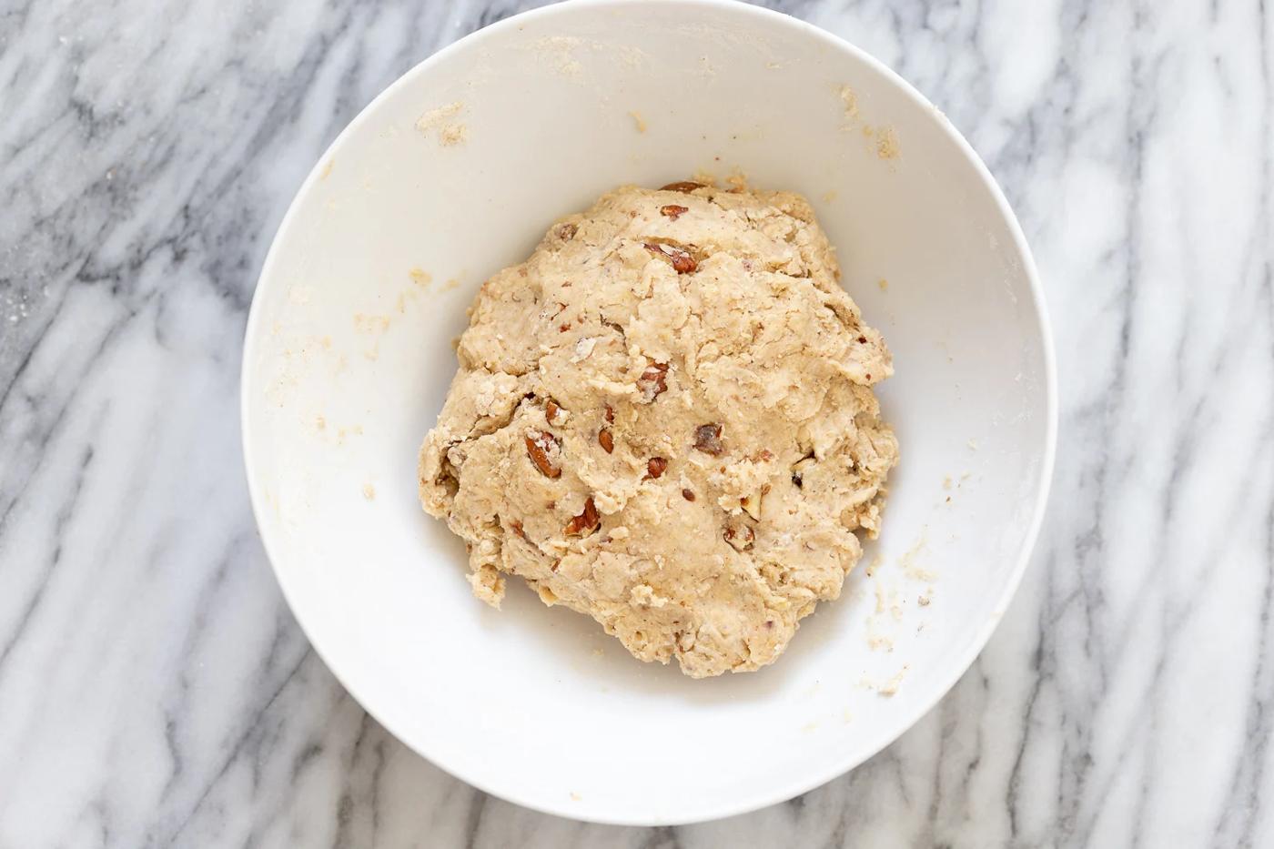 vegan banana bread scone dough in a white mixing bowl