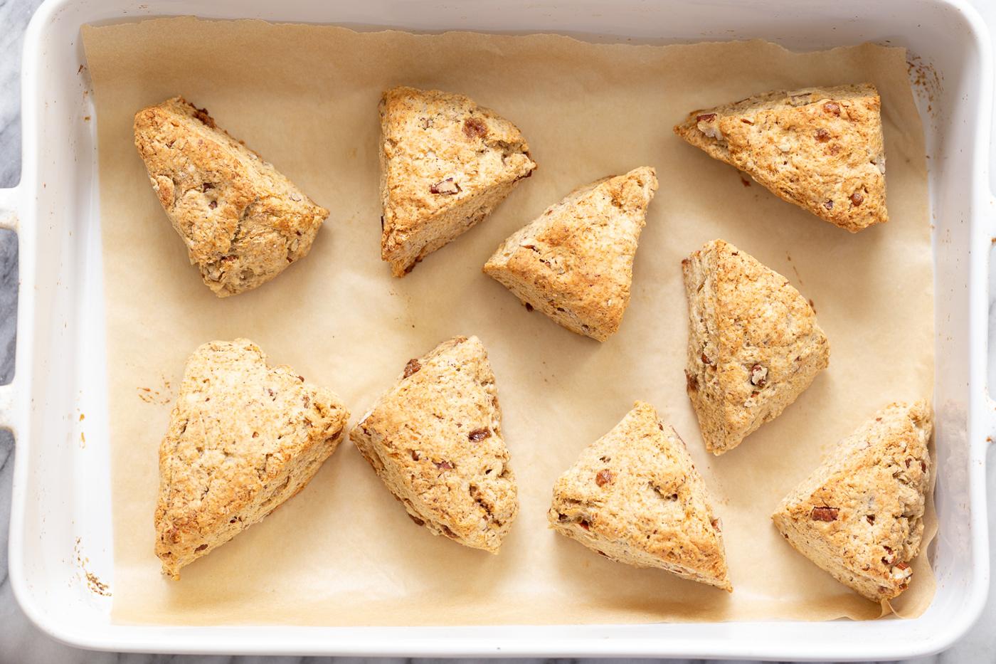 freshly baked golden brown vegan banana scones on a cookie sheet