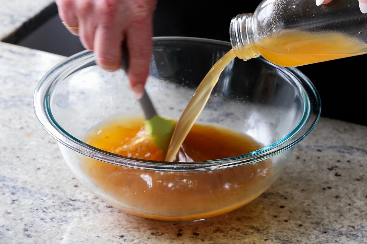 adding vegan beef broth to the bowl