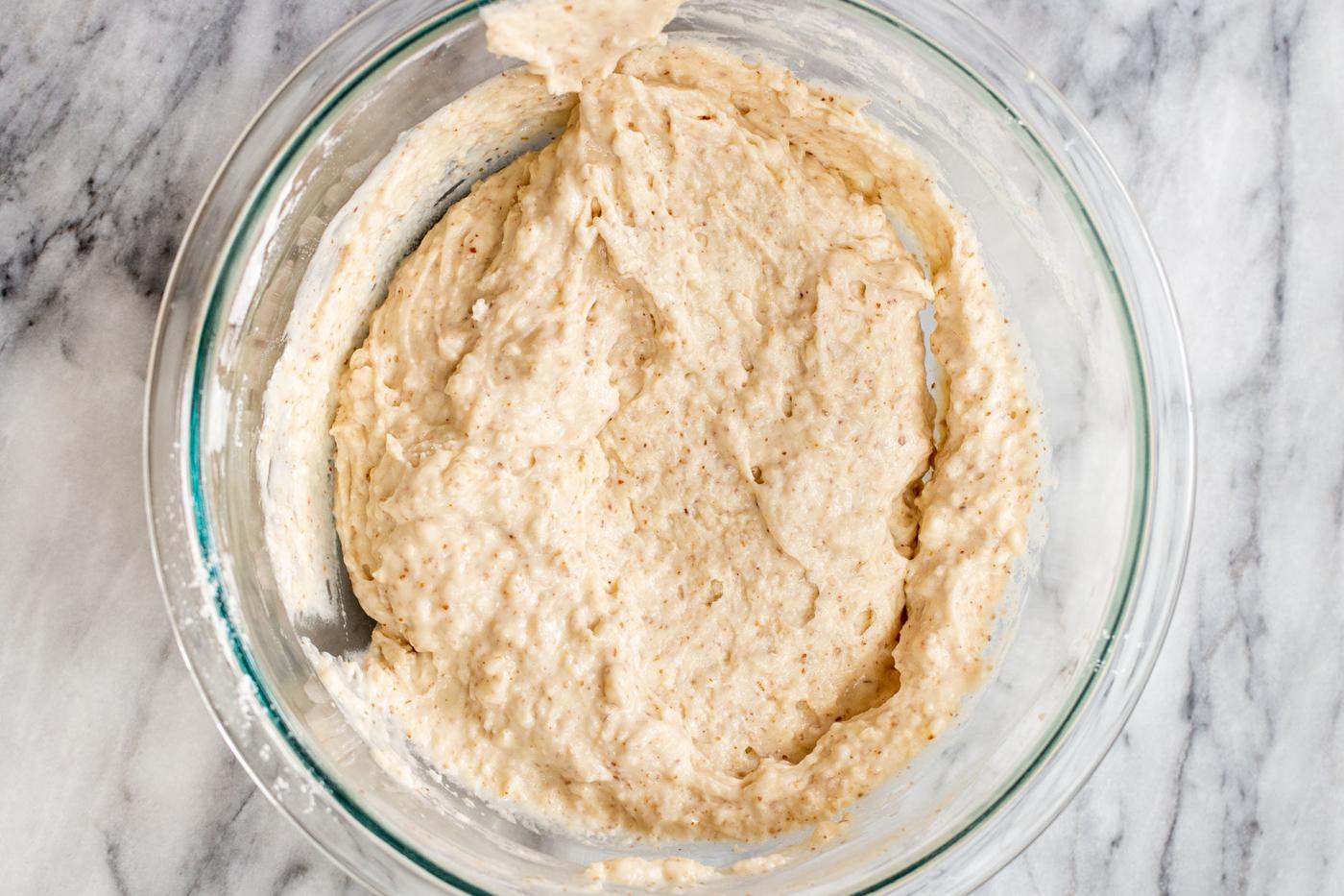 mixed cake batter ingredients in a glass bowl