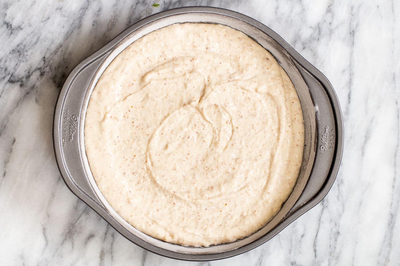 vegan cake batter in a springform pan