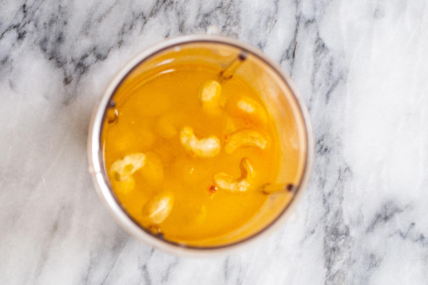 cashews turmeric and water in a blender