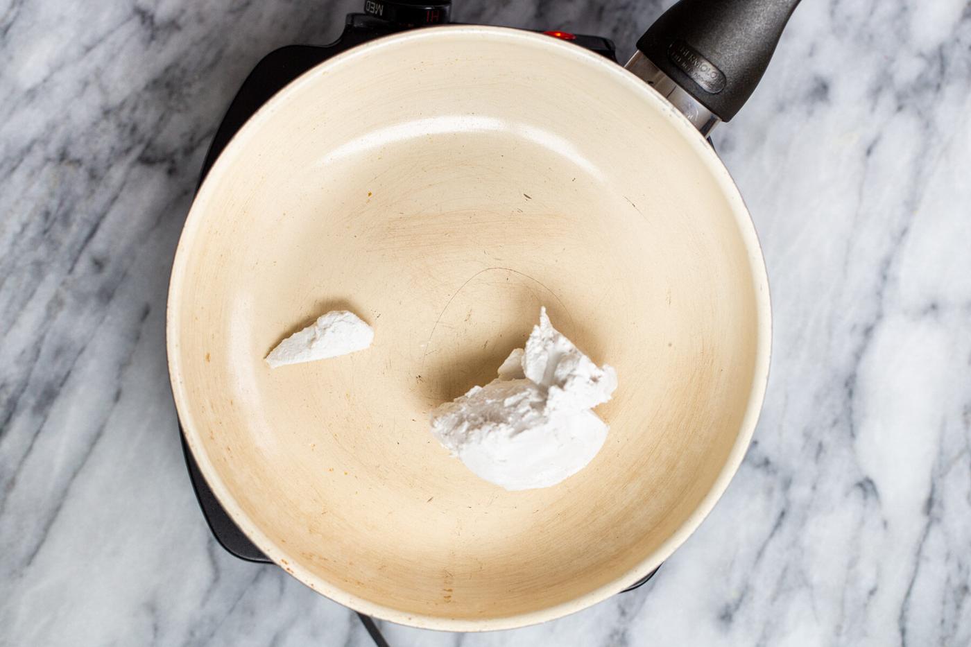coconut cream in a sauteeing pan
