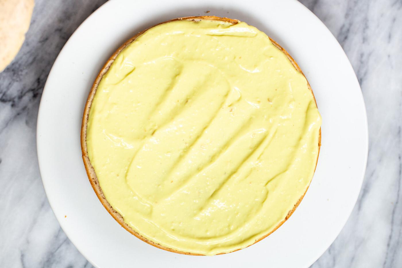 vegan boston cream pie cake being assembled