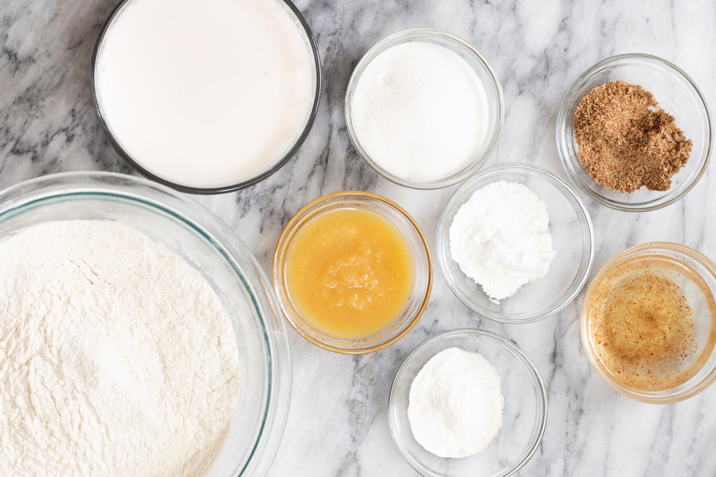 ingredients for making vegan sponge cake on a marble countertop
