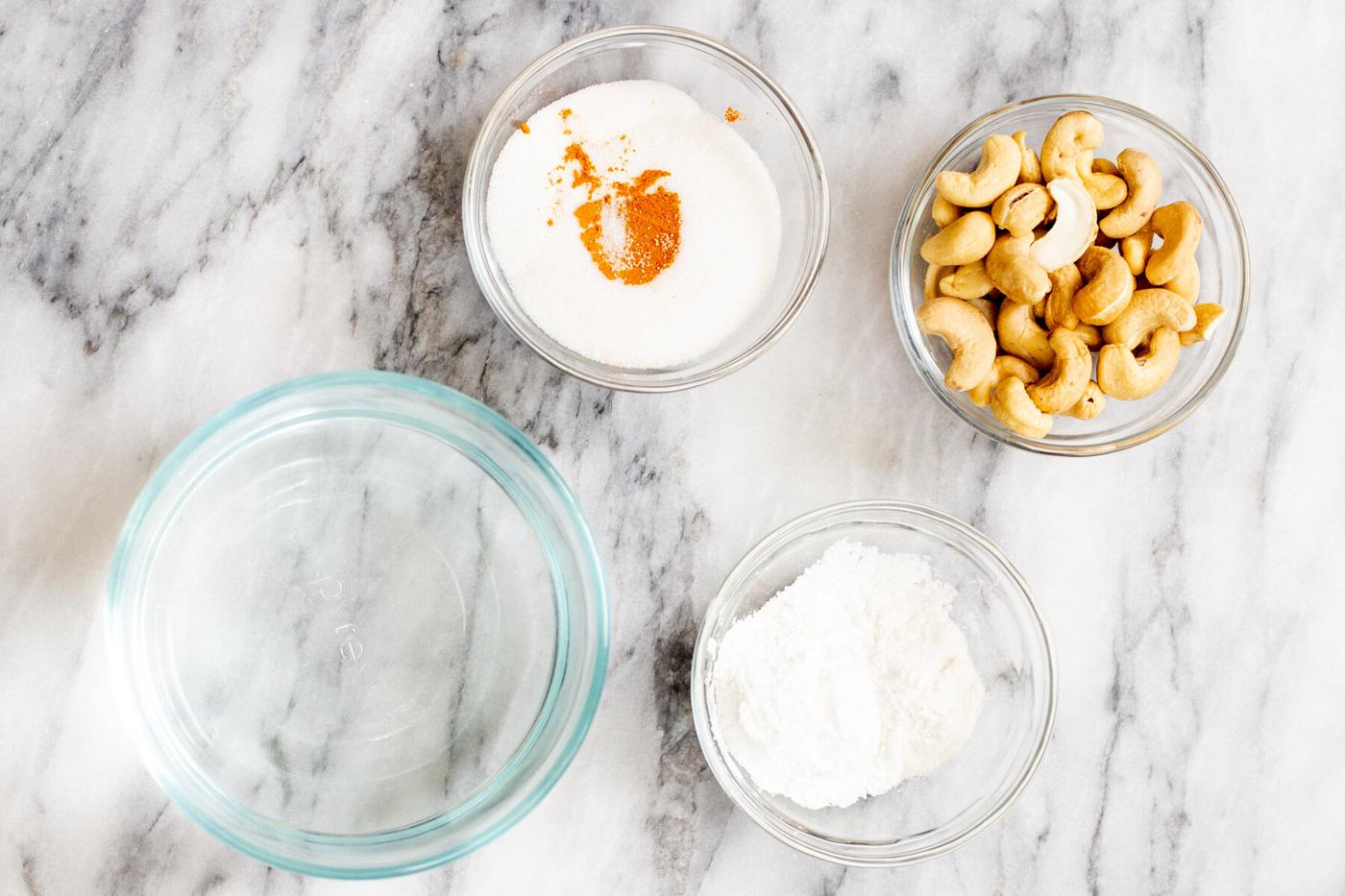 ingredients for making vegan vanilla custard on a marble countertop
