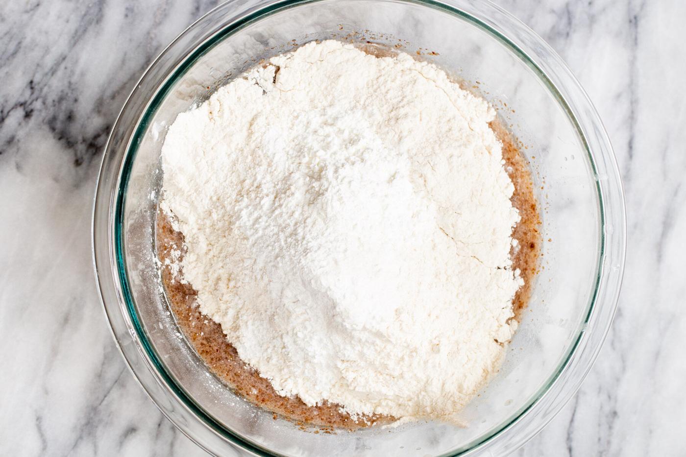 liquid and dry ingredients in a glass bowl