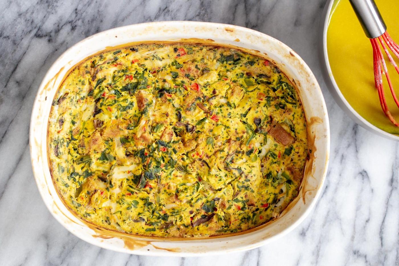 freshly baked vegan breakfast casserole in a white ceramic baking dish