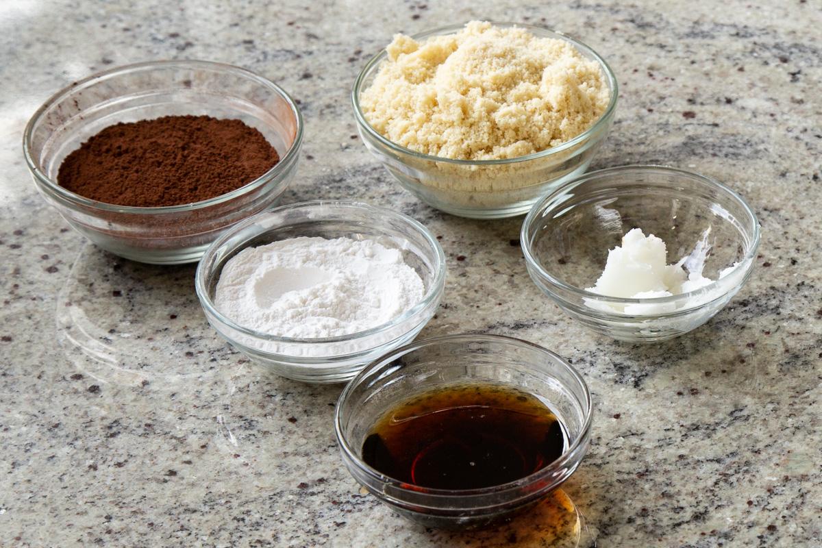 almond flour and other brookie ingredients in bowls on a kitchen table