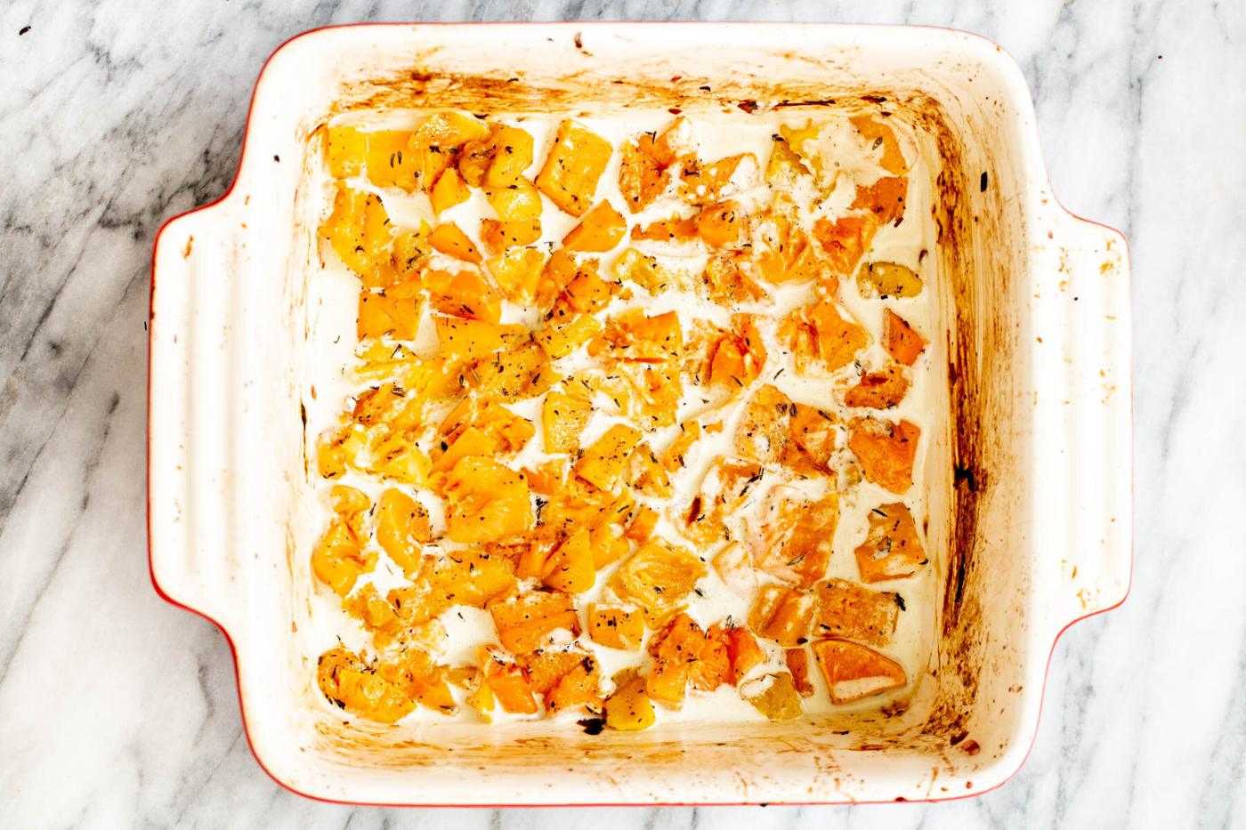 butternut squash lasagna being assembled in a casserole dish