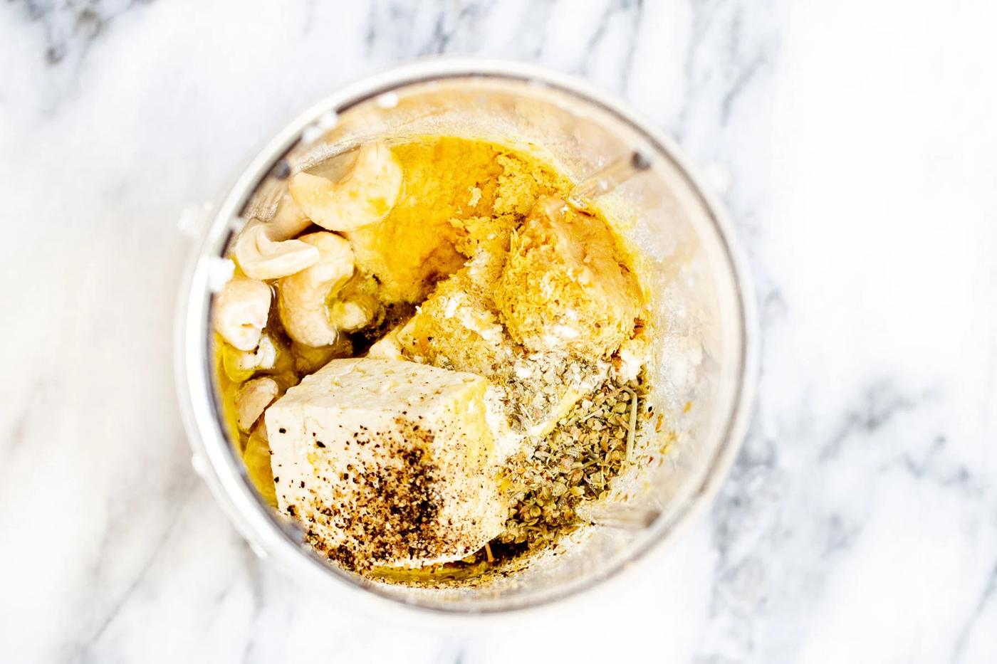 ingredients for vegan cashew bechamel sauce in a blender