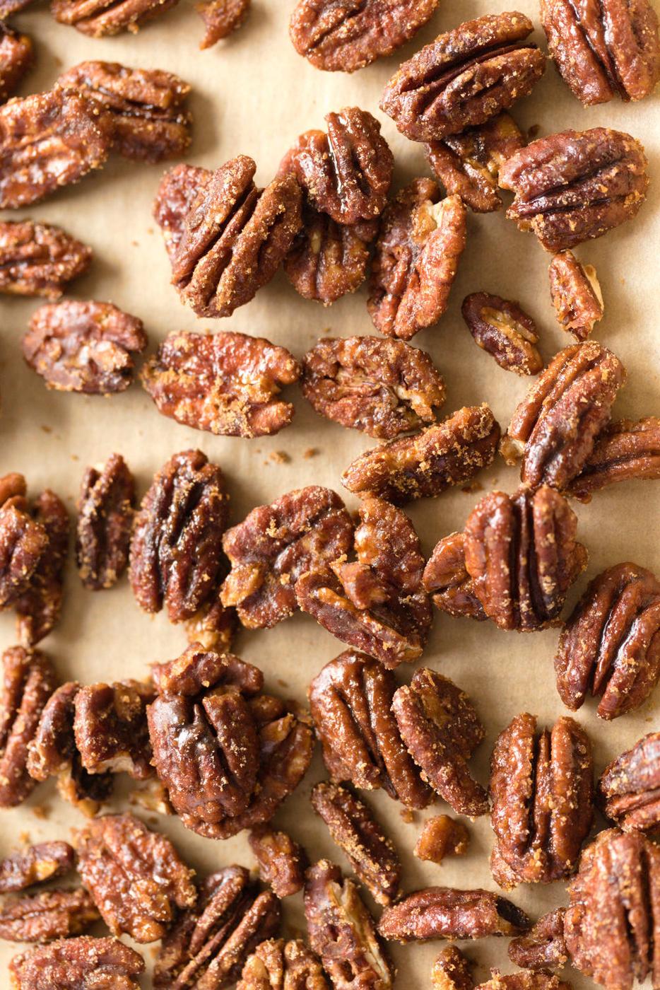 Vegan Candied Pecans on parchment lined sheet