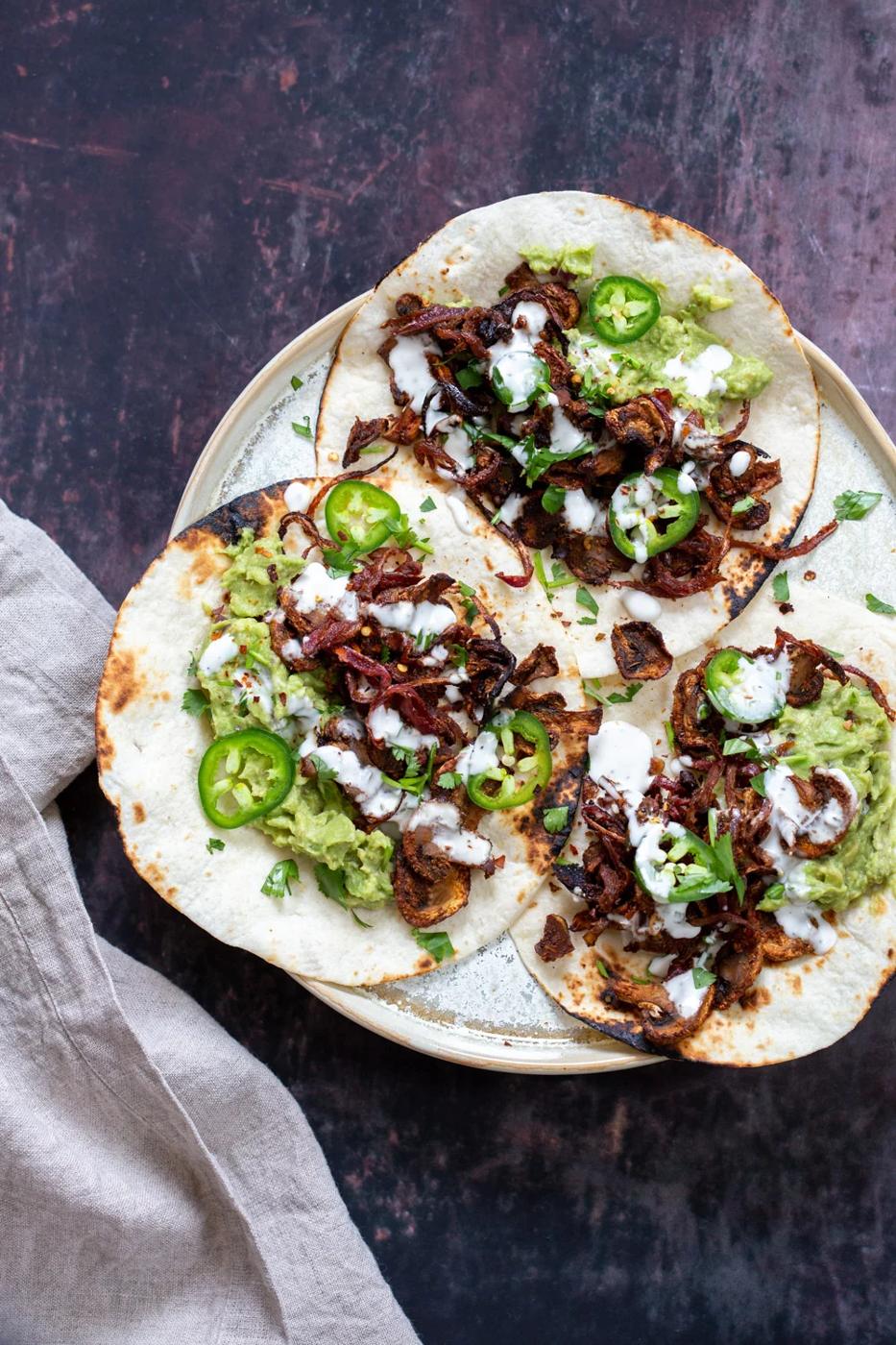 Vegan Carnitas. Mushrooms marinated in Spicy Smoky Zesty Marinade, Baked and served with toppings in tacos, wraps, burritos. Use jackfruit for variation. #vegan #Glutenfree #Nutfree #Oilfree #Recipe. Soyfree option #VeganRicha #mushroomcarnitas #veganarnitas